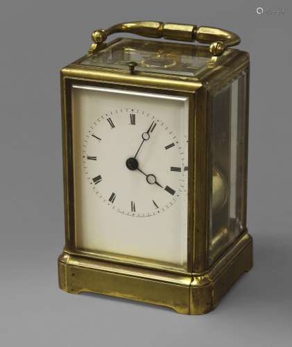 A FRENCH BRASS CARRIAGE CLOCK, with white enamelled dial and...