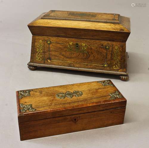 A REGENCY ROSEWOOD BRASS INLAID TEA CADDY, a sarcophagus sha...