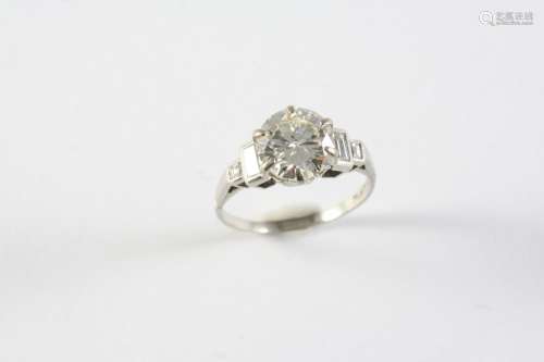 A DIAMOND SOLITAIRE RING the round old brilliant-cut diamond...