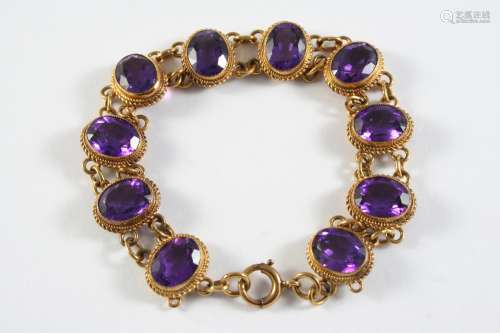 AN AMETHYST AND GOLD BRACELET the ten oval-shaped amethysts ...