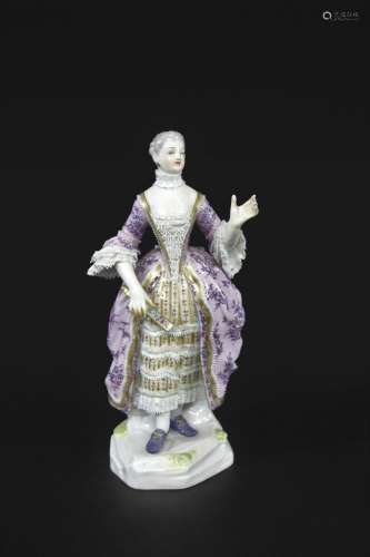 MEISSEN FIGURE OF A LADY a late 19thc figure of a lady holdi...