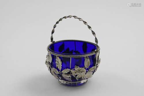 A VICTORIAN SWING-HANDLED SUGAR BASKET with a blue glass lin...