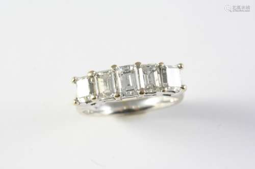 A DIAMOND FIVE STONE RING the five graduated emerald-cut dia...