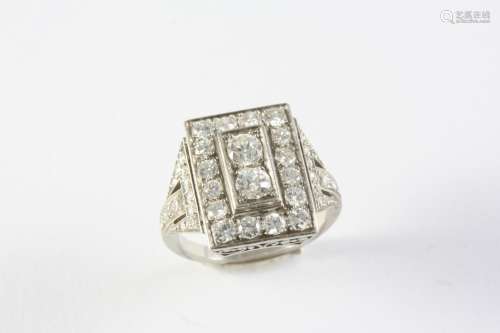 A DIAMOND CLUSTER RING the two central circular-cut diamonds...