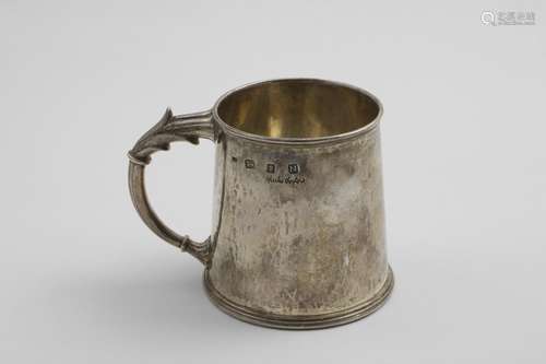 A MID 20TH CENTURY HANDMADE MUG with a tapering body, hammer...