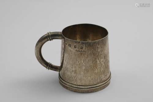 A MID 20TH CENTURY HANDMADE MUG with a tapering body and a h...