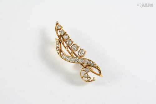 A DIAMOND AND GOLD LILY OF THE VALLEY BROOCH set overall wit...