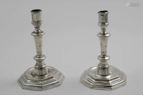 A PAIR OF 18TH CENTURY FRENCH CANDLESTICKS on stepped octago...