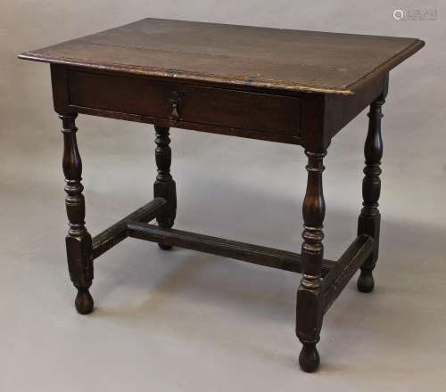 AN 18th CENTURY OAK SIDE TABLE, with a three plank top with ...