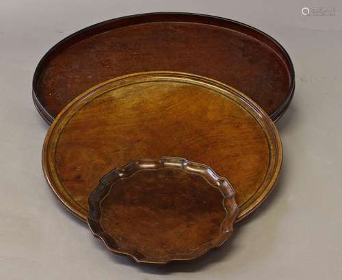 A GEORGE III STYLE MAHOGANY TRAY AND TWO OTHERS, A Chippenda...