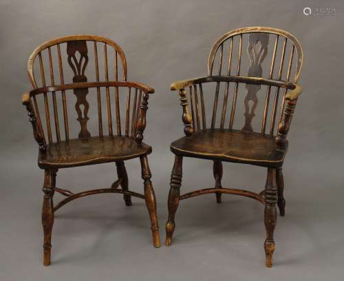 A NEAR PAIR OF 19TH CENTURY BEECH AND ELM WINDSOR ARM CHAIRS...