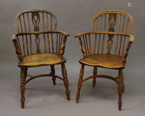 A NEAR PAIR OF 19TH CENTURY BEECH AND ELM WINDSOR ARM CHAIRS...