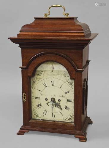 A MAHOGANY CASED BRACKET CLOCK WITH A PAINTED DIAL, the arch...