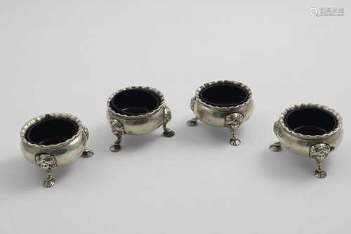 A SET OF FOUR GEORGE II SCOTTISH SALTS of squat circular for...