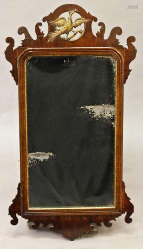 AN 18th CENTURY WALNUT 'FRET' WALL MIRROR, the rectangular p...