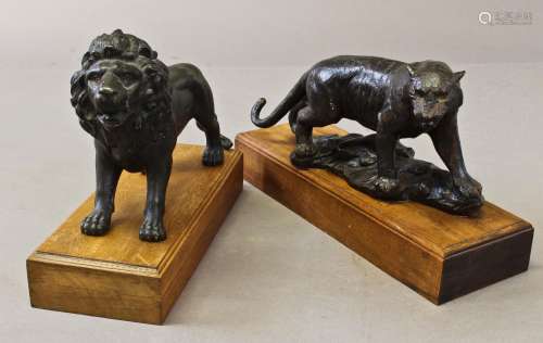 A BRONZE SCULPTURE OF A PROWLING LION AND ANOTHER. the lion ...
