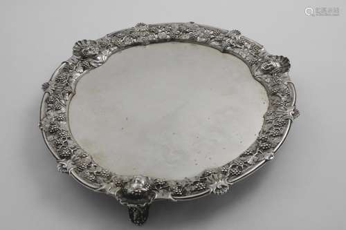 A GEORGE II SALVER of shaped circular outline with a cast op...