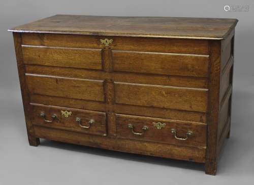 A LATE 17TH OR EARLY 18TH CENTURY OAK MULE CHEST, The two pl...