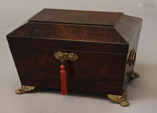A REGENCY ROSEWOOD WORKBOX, of sarcophagus form with taperin...