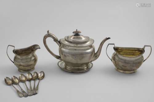 A GEORGE III TEA SET with oval bodies, gadrooned borders and...