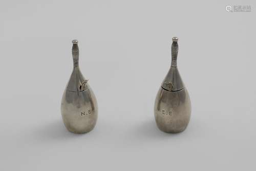 A PAIR OF EARLY 20TH CENTURY NOVELTY MUSTARD POTS in the for...