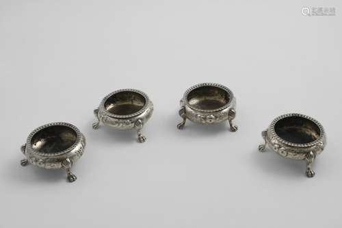 A SET OF FOUR VICTORIAN SQUAT CIRCULAR SALTS on three fluted...