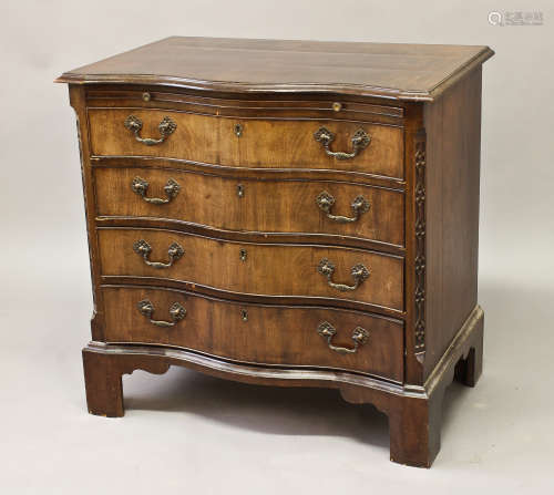 A GEORGE III STYLE MAHOGANY SERPENTINE FRONTED CHEST, the sh...