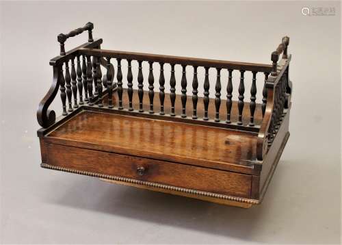 A REGENCY ROSEWOOD DESK STAND, the upper section with finely...