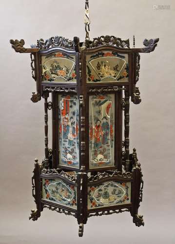 A CHINESE HARDWOOD FRAMED HANGING LANTERN, of hexagonal form...