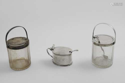 A PAIR OF EDWARDIAN MOUNTED GLASS PRESERVE JARS with cam-ope...