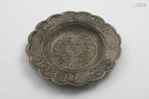 A PARCELGILT DISH of lobed circular outline with pierced rou...