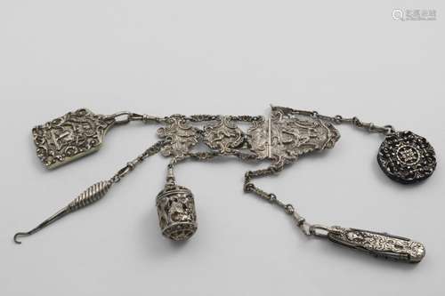 A LATE VICTORIAN CHATELAINE with chased, linked panels and c...