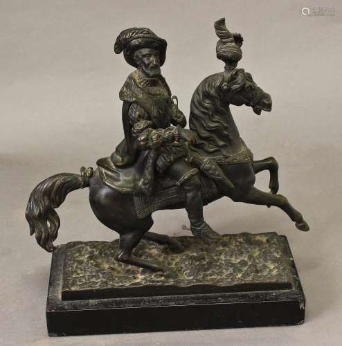 A BRONZE FIGURE OF A NOBLEMAN ON HORSE BACK, the figure wear...