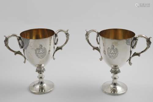 A PAIR OF VICTORIAN ELECTROPLATED TROPHY CUPS with gilt inte...