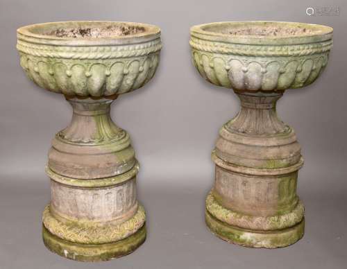 A LARGE PAIR OF RECONSTITUTED STONE PLANTERS ON STANDS, each...