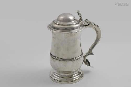 A GEORGE III BALUSTER TANKARD with an applied moulded girdle...