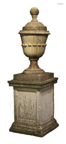 A LARGE RECONSTITUTED STONE GARDEN URN ON PEDESTAL, the urn ...