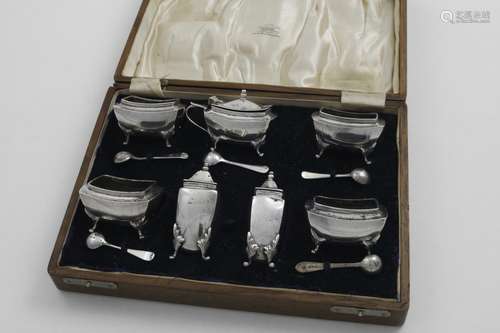 AN EARLY 20TH CENTURY CASED SEVEN-PIECE CONDIMENT SET by H. ...