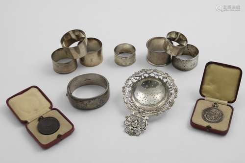 A MIXED LOT:- A pair of Victorian engraved napkin rings, fiv...