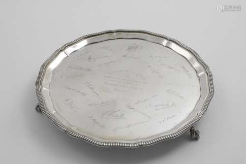 A MID 20TH CENTURY SALVER of shaped circular outline with a ...