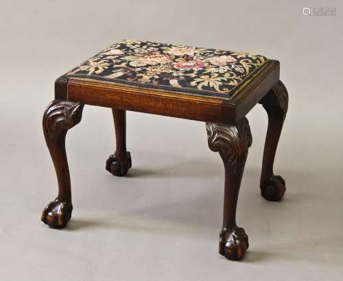 A GEORGE III STYLE MAHOGANY FRAMED STOOL, with rectangular d...