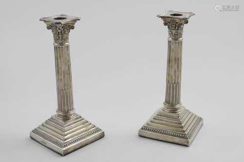 A PAIR OF EARLY 20TH CENTURY CANDLESTICKS on stepped square ...
