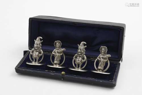 A RARE CASED SET OF FOUR CAST MENU CARD HOLDERS on circular ...