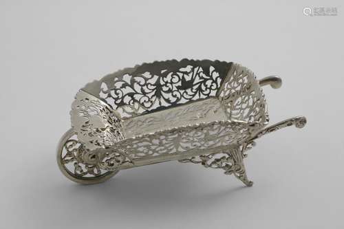 AN EDWARDIAN BONBON DISH in the form of a wheelbarrow with p...