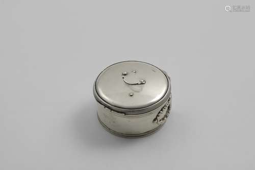 A GEORGE III CIRCULAR BOUGIE BOX with reeded borders and a f...