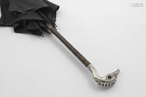 AN EARLY 20TH CENTURY BLACK SILK UMBRELLA with a mounted can...