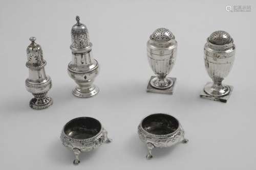 A PAIR OF GEORGE III VASE-SHAPED PEPPER CASTERS with bun cov...