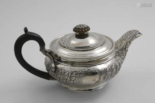 A GEORGE III SQUAT CIRCULAR TEA POT with a chased frieze of ...