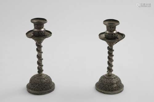 A PAIR OF LATE 19TH CENTURY INDIAN CANDLESTICKS on domed bas...