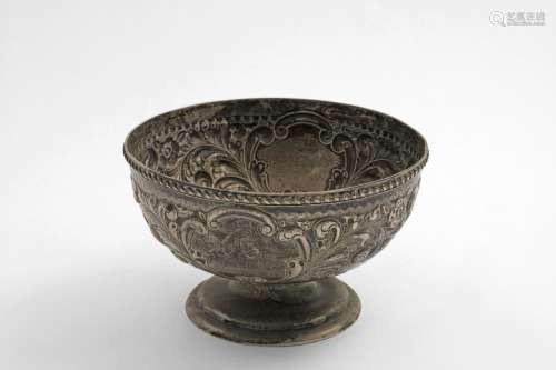 AN EDWARDIAN CIRCULAR ROSE BOWL with embossed decoration and...